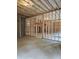 Spacious unfinished basement with wooden framing, with light entering from windows, ready for customization at 195 Silvercrest Dr, Acworth, GA 30101