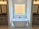 Bathroom with a soaking tub between two vanities at 195 Silvercrest Dr, Acworth, GA 30101