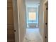 Bright bathroom with soaking tub, marble floors, and a modern design at 195 Silvercrest Dr, Acworth, GA 30101