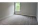 This bedroom features neutral walls, plush carpeting, and a window that provides plenty of natural light at 195 Silvercrest Dr, Acworth, GA 30101