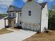 A well-manicured lawn and a classic white two-story home with attached garage at 195 Silvercrest Dr, Acworth, GA 30101