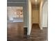 Hallway leading to the kitchen, showcasing hardwood floors and neutral paint at 195 Silvercrest Dr, Acworth, GA 30101