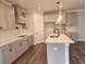 Modern kitchen with gray cabinets, stainless steel appliances, and a spacious island at 195 Silvercrest Dr, Acworth, GA 30101
