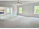 Spacious living room with neutral walls, plush carpeting, and ample natural light from large windows at 195 Silvercrest Dr, Acworth, GA 30101