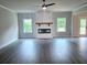 Bright living room with modern fireplace, hardwood floors, and lots of natural light at 195 Silvercrest Dr, Acworth, GA 30101