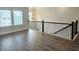 Loft with hardwood floors, a stylish chandelier, and natural light from several windows at 195 Silvercrest Dr, Acworth, GA 30101