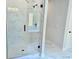 Bathroom with a glass enclosed shower, marble tile walls, and a modern shower head at 195 Silvercrest Dr, Acworth, GA 30101
