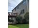 Back view of the home featuring a wooden deck, lower patio, and spacious yard at 4217 Mill Grove Sw Ln, Smyrna, GA 30082