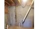 Unfinished basement features concrete walls and ceiling pipes at 4217 Mill Grove Sw Ln, Smyrna, GA 30082