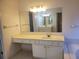 Bright bathroom with a large mirror over vanity and tiled floors at 4217 Mill Grove Sw Ln, Smyrna, GA 30082