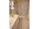 Bright bathroom features a single sink vanity with a tub and shower combination at 4217 Mill Grove Sw Ln, Smyrna, GA 30082