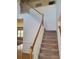 Interior view of the foyer with carpeted stairs and wood trim at 4217 Mill Grove Sw Ln, Smyrna, GA 30082