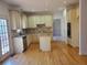 A view of the kitchen with granite countertops, wooden cabinets, and stainless appliances at 4217 Mill Grove Sw Ln, Smyrna, GA 30082