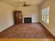 Open living room featuring carpet, windows, and a fireplace at 4217 Mill Grove Sw Ln, Smyrna, GA 30082