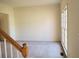 Spacious living room featuring neutral carpet and a large window at 4217 Mill Grove Sw Ln, Smyrna, GA 30082