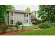 Beautifully landscaped backyard with patio and deck, ideal for outdoor enjoyment at 8895 Club River Dr, Roswell, GA 30076