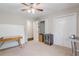 Bedroom features a ceiling fan, carpet floors, closet doors, and an adjacent hallway entry at 8895 Club River Dr, Roswell, GA 30076