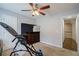 Comfortable bedroom with carpet flooring, ceiling fan, and a wooden dresser against a headboard at 8895 Club River Dr, Roswell, GA 30076