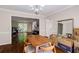 Open-concept dining room featuring hardwood floors and modern decor at 8895 Club River Dr, Roswell, GA 30076