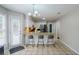 Updated kitchen with granite breakfast bar, stainless steel appliances, and tile flooring at 8895 Club River Dr, Roswell, GA 30076
