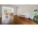 Spacious living area boasting hardwood flooring and seamless access to the dining area at 8895 Club River Dr, Roswell, GA 30076