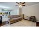 Inviting living room with plush seating, natural light, and an open view to the kitchen area at 8895 Club River Dr, Roswell, GA 30076