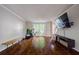 Bright and airy living room featuring hardwood floors and large windows at 8895 Club River Dr, Roswell, GA 30076