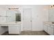 Bright bathroom featuring dual sinks, large mirrors, and tiled floors at 136 Parkstone Way, Marietta, GA 30066