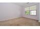 Carpeted bedroom features window with blinds at 136 Parkstone Way, Marietta, GA 30066