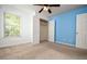 Bedroom with blue wall, carpet, and walk-in closet at 136 Parkstone Way, Marietta, GA 30066