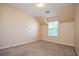 Bedroom with carpet, angled ceiling, and large window at 136 Parkstone Way, Marietta, GA 30066