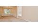Dining space with a large window, wainscoting detail, and neutral paint at 136 Parkstone Way, Marietta, GA 30066
