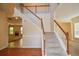 Inviting foyer with staircase, wood floors, and neutral paint at 136 Parkstone Way, Marietta, GA 30066