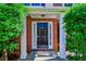 Covered front entrance featuring a black door flanked by sidelights at 136 Parkstone Way, Marietta, GA 30066