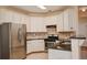 Modern kitchen with stainless steel appliances and granite countertops at 136 Parkstone Way, Marietta, GA 30066