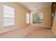 Bright living room featuring multiple windows letting in natural light, and neutral walls at 136 Parkstone Way, Marietta, GA 30066