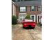 Brick townhome with driveway, green door, and a U-Haul moving truck nearby at 4612 Grand Central Pkwy, Decatur, GA 30035