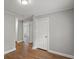 Spacious hallway featuring hardwood floors and multiple doorways leading to different rooms at 5074 Park Ave, Forest Park, GA 30297
