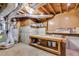 Unfinished basement with wooden workbench and utilities ready to be transformed at 5077 Fieldview Dr, Douglasville, GA 30135