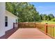 Spacious wooden deck perfect for outdoor entertaining with a view of the backyard at 5077 Fieldview Dr, Douglasville, GA 30135