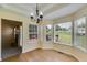 Spacious dining area boasting hardwood floors, a stylish chandelier, and a bright, inviting atmosphere at 5077 Fieldview Dr, Douglasville, GA 30135