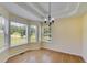 Open dining room featuring hardwood floors, modern chandelier, and large windows with views at 5077 Fieldview Dr, Douglasville, GA 30135