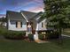 Charming home featuring a beautifully landscaped front yard and covered entryway at 5077 Fieldview Dr, Douglasville, GA 30135