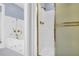 Bathroom including a white shower with glass sliding doors and gold fixtures at 740 Skyline Dr, Covington, GA 30014