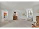 Bedroom featuring carpeted floors, a large window, and a view to an adjacent room at 740 Skyline Dr, Covington, GA 30014