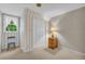 Bedroom with patterned wallpaper, a closet, and a window with natural light at 740 Skyline Dr, Covington, GA 30014