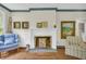 Cozy living room showcasing a fireplace, hardwood floors, and classic decor at 740 Skyline Dr, Covington, GA 30014