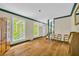 Spacious living room featuring hardwood floors, and two windows with natural light at 740 Skyline Dr, Covington, GA 30014