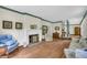 Spacious living room with hardwood floors, a fireplace, and comfortable seating at 740 Skyline Dr, Covington, GA 30014