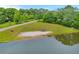 Scenic view of a tranquil pond with a sandy beach area, perfect for outdoor enjoyment and relaxation at 740 Skyline Dr, Covington, GA 30014